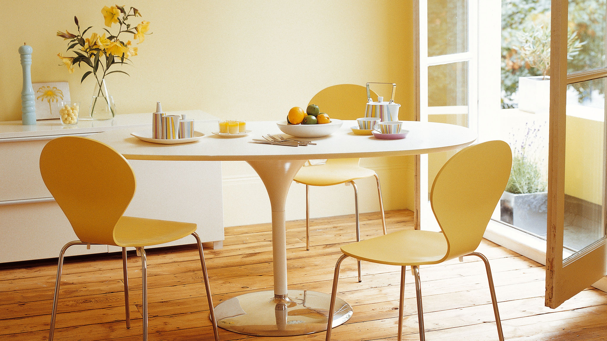 Use sunny paint colours A sunny hue can brighten and warm a dark, dingy space: don't be afraid to use light terracotta or yellow paint colours