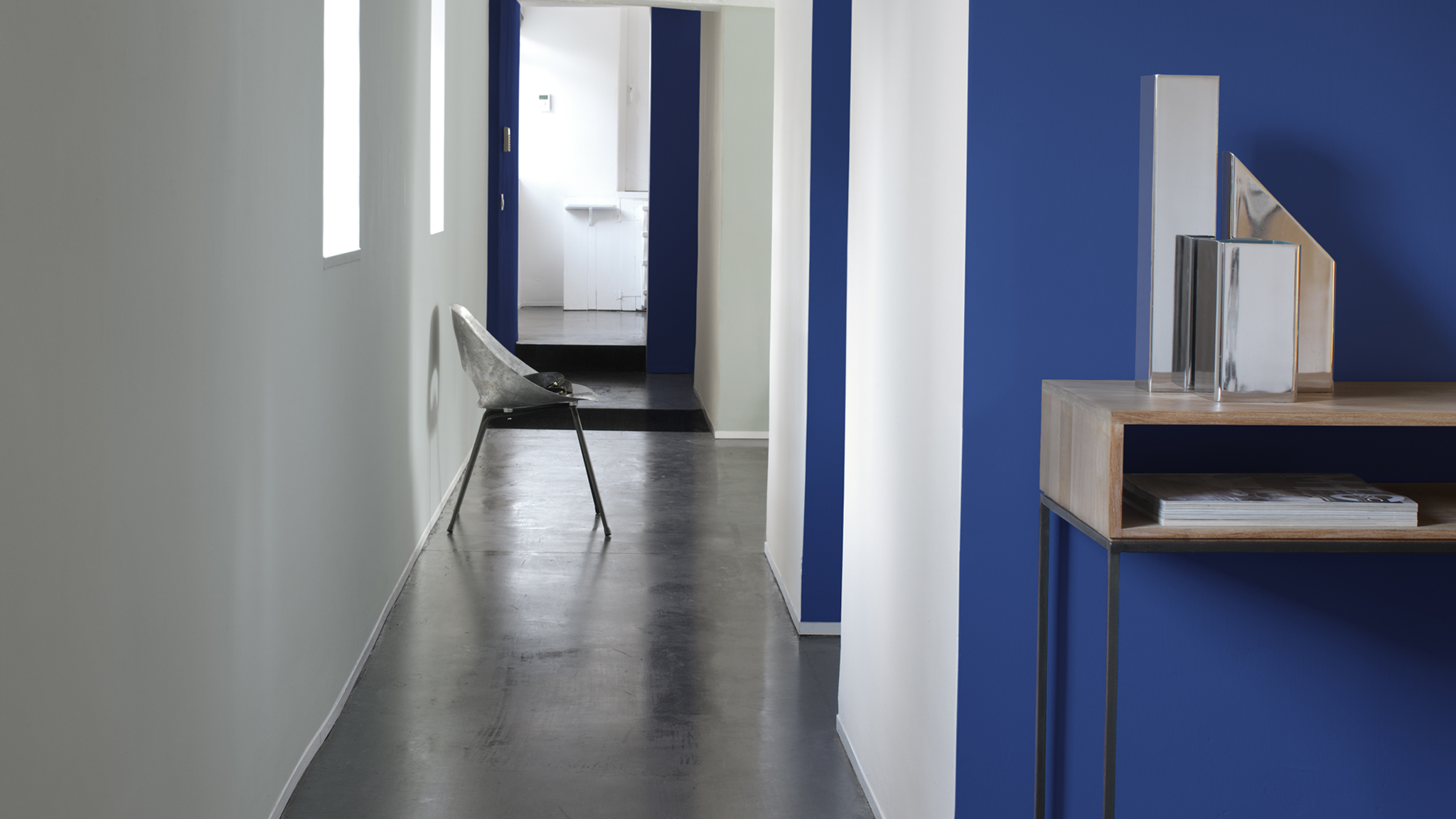 Make space with an optical illusion Contrasting pale woodwork with dark walls is a clever way to create the illusion of space in your home